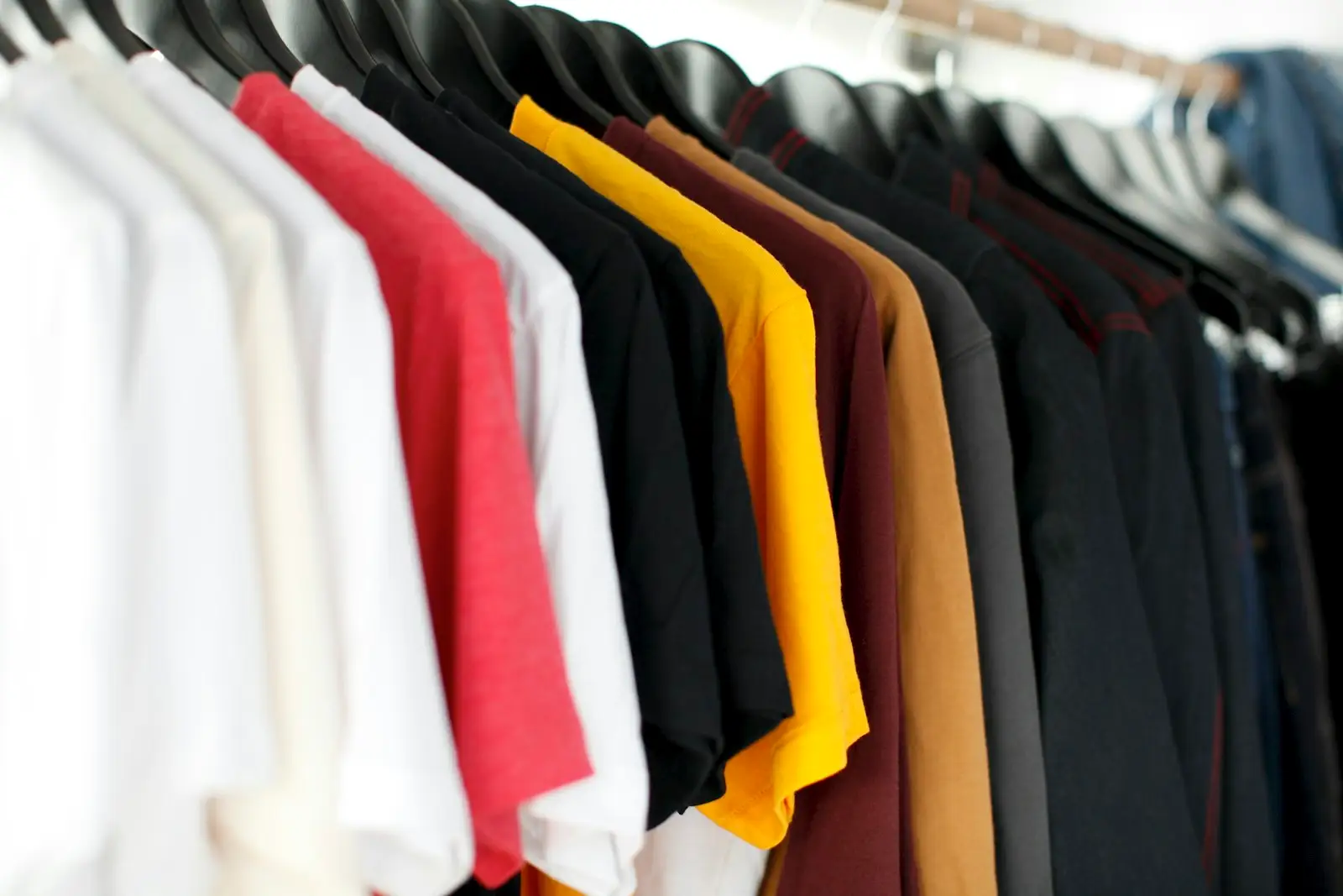 Close-up of shirts hanging on a clothing rack